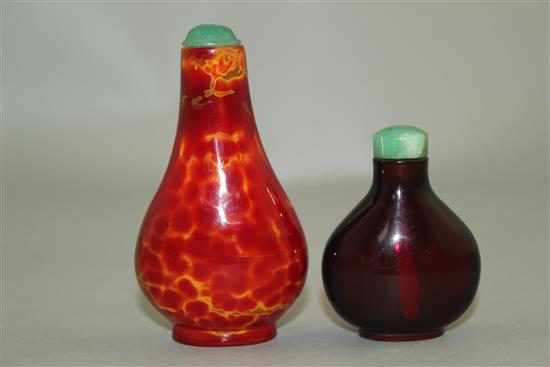 Two Chinese glass snuff bottles, 18th / 19th century, 4.1cm, the latter with jadeite stopper